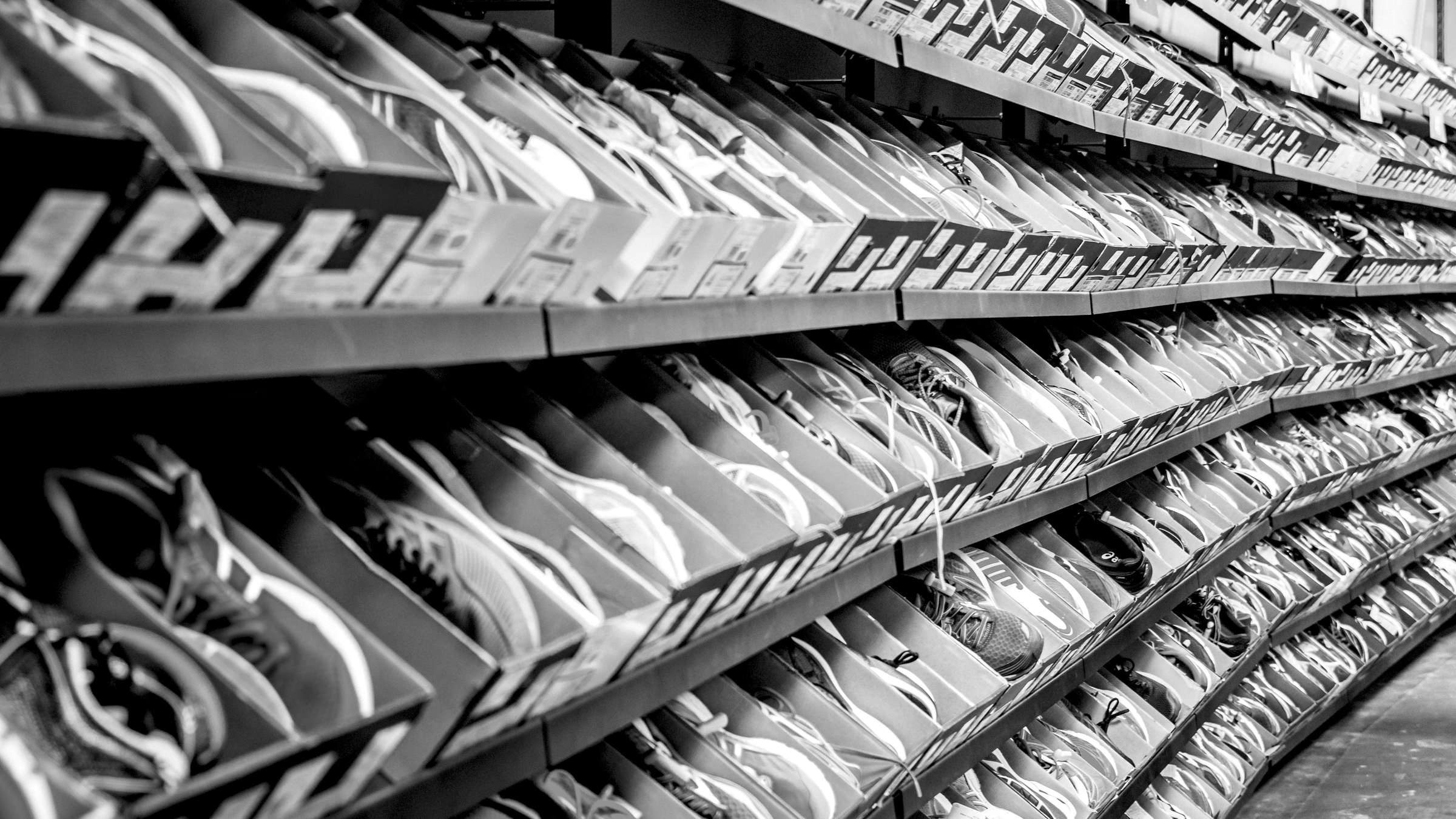 Shoe boxes stacked on retail shelves